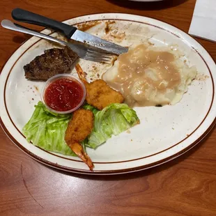 This was the steak and shrimp. Steak was way over cooked. Mashed potatoes (notice all of them still on the plate) tasted like water.