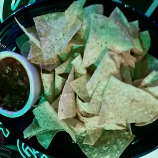 a plate of chips and salsa
