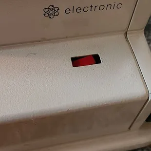 Button was forced into the machine and not put back into place. They should have put it back to where it was when I dropped it off