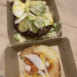 a burger and a salad in a box