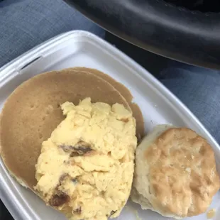 a breakfast of pancakes and a biscuit