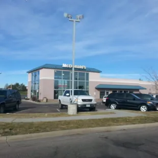 cars parked in front of a mcdonald&apos;s