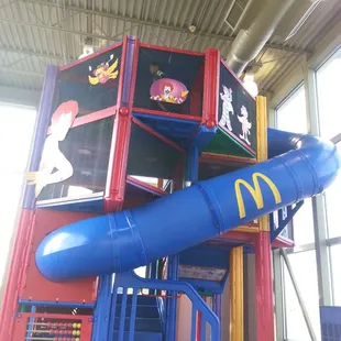 a large blue slide in a building