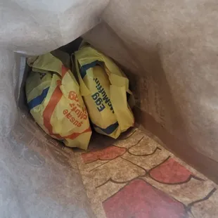 a pair of shoes in a paper bag
