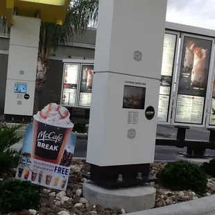 a vending machine in front of a mcdonald&apos;s