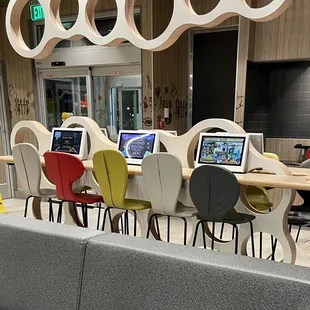 a restaurant with multiple tables and chairs