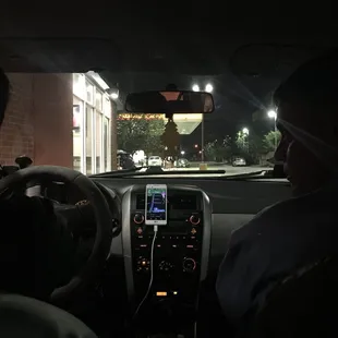 a man driving a car at night