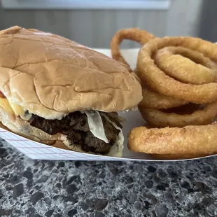 1/2 lb cheeseburger with onion rings