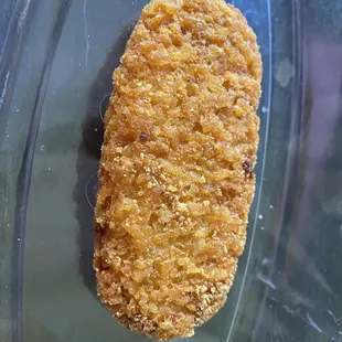 Hard as a rock, overcooked hash brown.