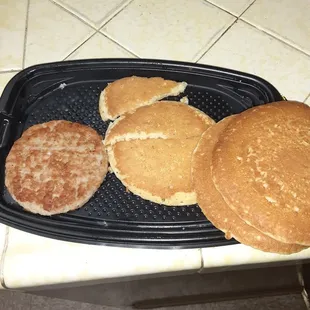 Hidden bottom pancake pieces. Looks like someone cut it to eat it. Unacceptable