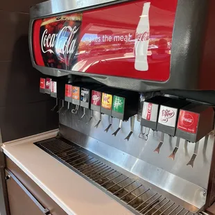 a coca cola machine with a lot of sodas