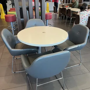 a table and chairs in a restaurant