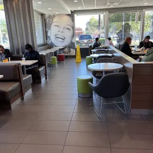 people sitting at tables in a restaurant