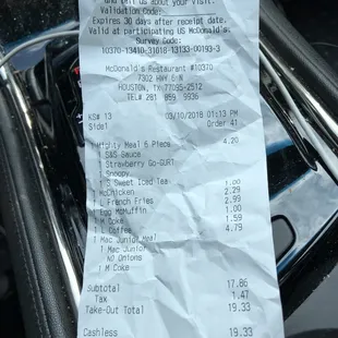 a receipt in the passenger seat of a car