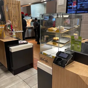 a counter with a phone and a menu