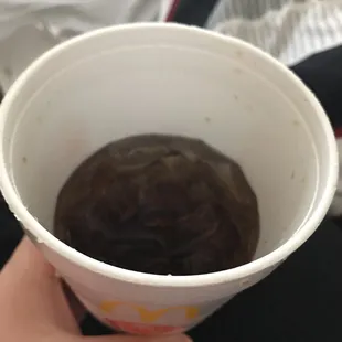 I was given this half empty coke in the drive thru, took one sip &amp; it tasted like dishwater because the syrup needs to be changed.