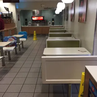 empty tables and chairs in a restaurant