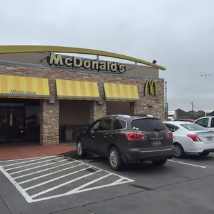 cars parked in front of a mcdonald's