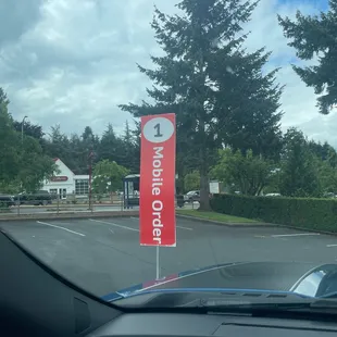 a no parking sign in a parking lot