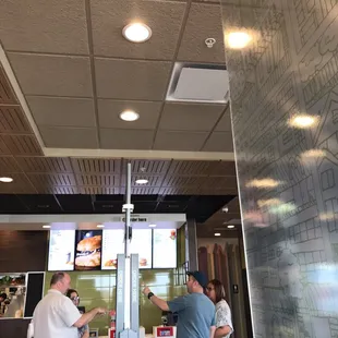 two men ordering food in a restaurant