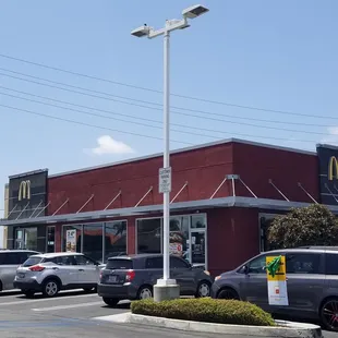 cars parked in front of a mcdonald's