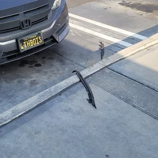 Plastic pieces from his car just thrown down when there's a trash can 10ft away.