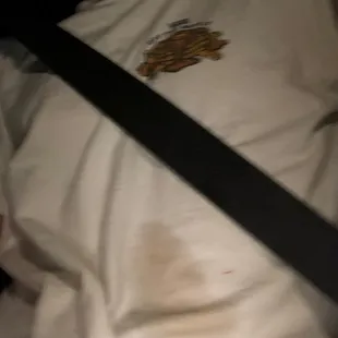 Spilled tea from broken lid