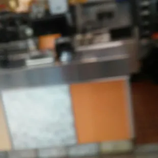 a blurry view of a restaurant counter