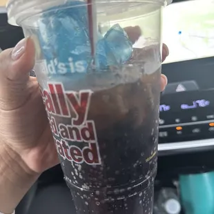 Used glove in Coke