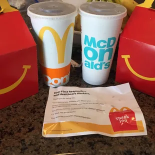 two cups of coffee and a bag of fries