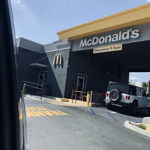 a car parked in front of a mcdonald&apos;s