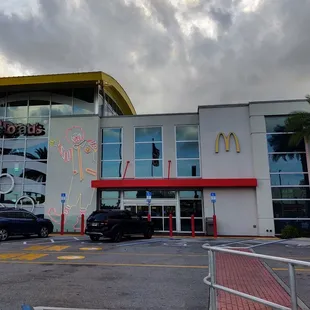 cars parked in front of a mcdonald's