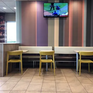 a television in the corner of a restaurant