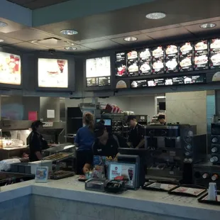 a man and a woman working in a restaurant