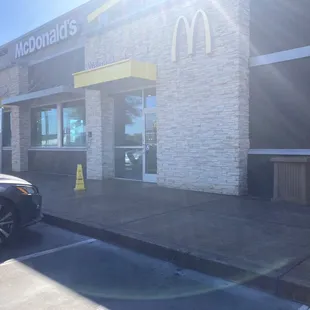 a car parked in front of a mcdonald&apos;s