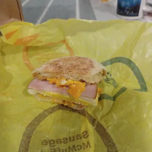 Egg McMuffin with ham, $3.59. Half eaten.