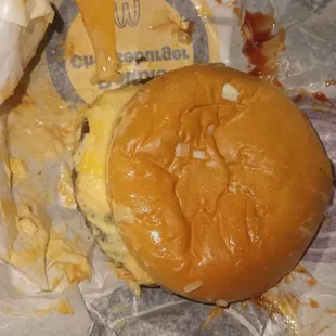 Nasty messy double cheeseburger with onions and Big Mac sauce from McDonald's in Riverside off Van Buren by Walmart address is 5010?