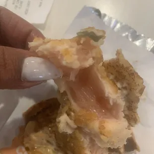 This is a chicken sandwich I got from McDonald's.. it was raw inside .. no refund nothing showed the mgr also ..