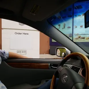 Waiting in line. 2 lanes. She told us to hold while she let 4 cars in the other lane order. We waited 10+ mins. We left.