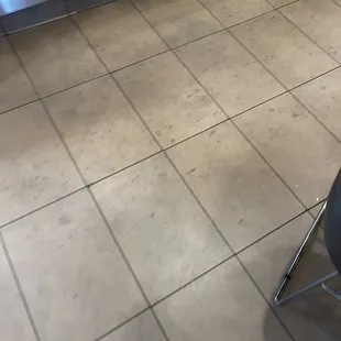 Sticky filthy stained tile floors around the indoor of McDonald's
