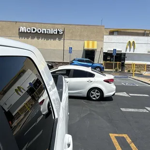 Drive thru window and me waiting in the waiting area for my food the last 15min.