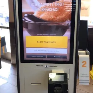 a breakfast menu on a digital kiosk