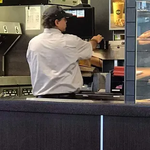 a man preparing food in a kitchen