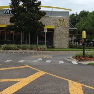 a mcdonald's on the corner of a street