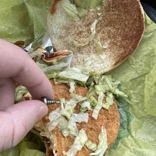 a chicken sandwich with lettuce