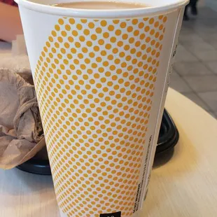 The tall coffee cup that I requested. You can see that all the contents of the small coffee cup, filled the large coffee cup to the top.