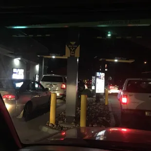 a view of a gas station at night