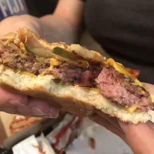 a person holding a hot dog