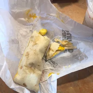 Extremely hard breakfast burrito, after waiting 15 mins to get my food in the drive-thru pull forward spot!
