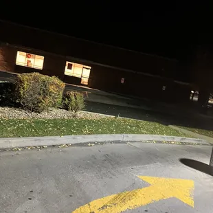 a yellow arrow painted on the road